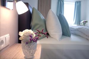 Ένα ή περισσότερα κρεβάτια σε δωμάτιο στο Hotel Claro Garni