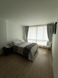Postel nebo postele na pokoji v ubytování Hospedaje Tunja