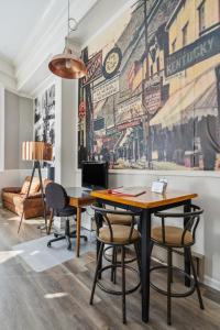 an office with a desk and chairs in front of a mural at THE CARRICK in Bisbee