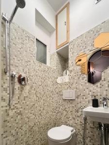 a bathroom with a toilet and a sink at Il Conventino delle Cinque Terre - Sea View - AC&WiFi - Vernazzarentals in Vernazza
