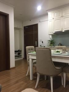 a kitchen and dining room with a table and chairs at S1-The Sapphire 05A11A - 2sleep, 2wc in Ha Long