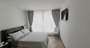 Postel nebo postele na pokoji v ubytování Hospedaje Tunja