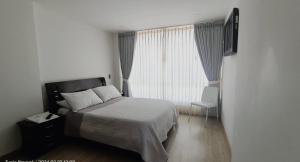 Postel nebo postele na pokoji v ubytování Hospedaje Tunja
