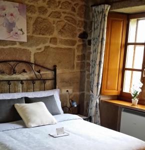Postel nebo postele na pokoji v ubytování Casa Rural Vella da Rivera