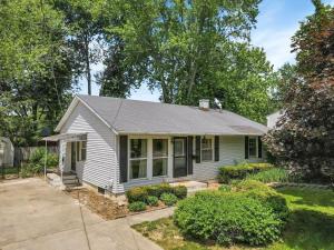 a white house with a gray roof at Housepitality - Electric Ave - 3 BDR and Hot Tub in Westerville