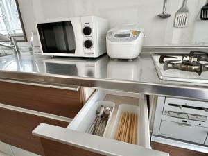 Dapur atau dapur kecil di 大人気黒門市場徒歩1分 日本橋駅徒歩2分 道顿堀 難波 心斎橋徒歩圏内 金悦マンション