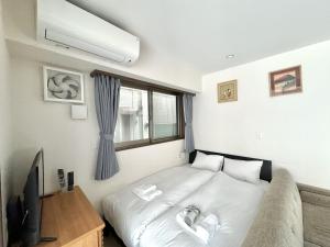 Katil atau katil-katil dalam bilik di 大人気黒門市場徒歩1分 日本橋駅徒歩2分 道顿堀 難波 心斎橋徒歩圏内 金悦マンション