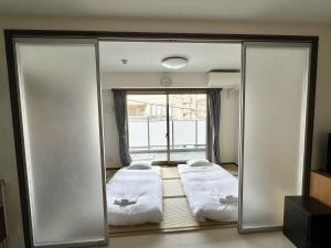Katil atau katil-katil dalam bilik di 大人気黒門市場徒歩1分 日本橋駅徒歩2分 道顿堀 難波 心斎橋徒歩圏内 金悦マンション