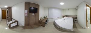 Postel nebo postele na pokoji v ubytování San Lucas Hotel