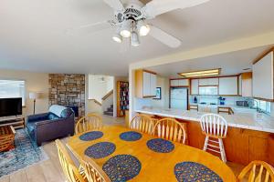 a dining room and kitchen with a table and chairs at Ocean Mornings in Cayucos