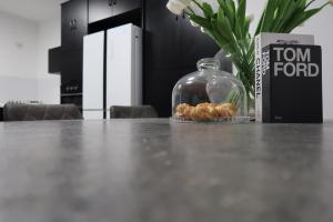 a glass jar of food sitting on a table at אחוזת העמק סוויטות בפוריה in Poriyya