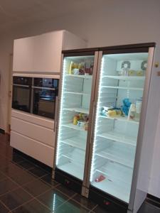 a refrigerator with its doors open in a kitchen at Olsson B&B in Randers