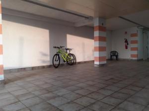 a bike is parked in a large room at B&B La Verbena in Siena +40 photos