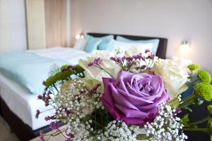 Ένα ή περισσότερα κρεβάτια σε δωμάτιο στο Hotel Claro Garni