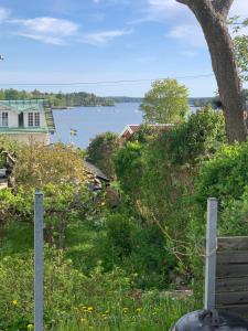 a view of a lake from a house at Sommarvilan in Vaxholm