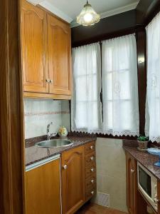 Kuchyňa alebo kuchynka v ubytovaní Apartamento ideal en Lastres