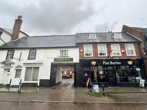 a building with a hotel and a pan barbour at Bella Vita Hitchin Town Centre in Hitchin