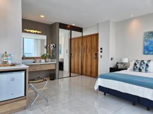Rúm í herbergi á Hotel Perla Spondylus