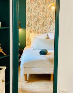 מיטה או מיטות בחדר ב-Appart 40m2 dans maison - Proche Paris
