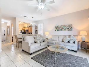 a living room with two couches and a table at Old Town Retreat At Regal Oaks By Mid Florida Home Management in Orlando