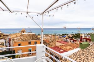 a view of the ocean from the balcony of a building at Modern Loft in the vibrant coast of Villajoyosa in Villajoyosa