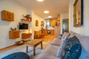 a living room with a couch and a table at 1 Bedroom Natural Condo in Sofia