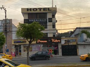 a hotel with a car parked in front of it at Hotel Shekinah Internacional in Esmeraldas