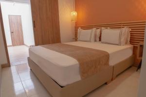 Postel nebo postele na pokoji v ubytování La Casona Hotel Boutique
