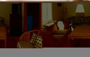 a living room with a couch and a chair at Nice Home In Olofström With Sauna in Olofström