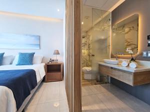 Rúm í herbergi á Hotel Perla Spondylus