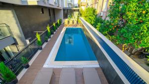 an overhead view of a swimming pool in a building at Stile Suite Marine Hotel in Antalya