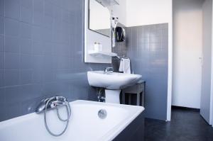 Koupelna v ubytování Hôtel Le Tivoli