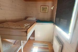 Postel nebo postele na pokoji v ubytování Gästhus på Fårös savann.