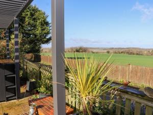 a view from the balcony of a house with a garden at The View in Faversham
