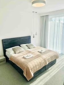 A bed or beds in a room at Centrum apartment - Parking,AC, balcony