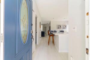 a blue door in a hallway with a kitchen at 150 Stunning 4BD Perfect for Your Vacation in Davenport +31 photos