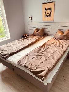 Säng eller sängar i ett rum på Lisa Lodge i Järvsö Ski and bike in and out