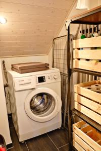 a washer and dryer in a small room at Charmante Ferienwohnung im Herzen Neuenwegs in Kleines Wiesental