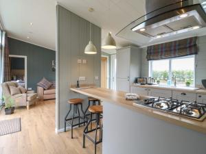 a kitchen with a counter and a stove top oven at Willow Lodge in Newark upon Trent