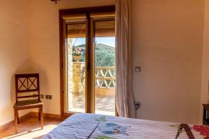 Postel nebo postele na pokoji v ubytování Casa Rural Can Ginesta