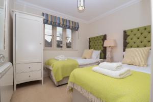 Säng eller sängar i ett rum på Hartlands, Aldeburgh