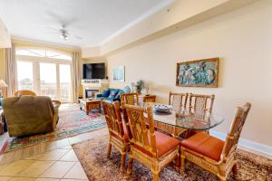 a living room with a glass table and chairs at South Beach 704 in Ocean City