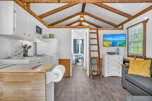 a kitchen and living room with a couch and a table at Treasure Harbor in Islamorada