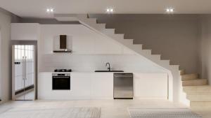 uma cozinha com um lavatório e uma escada em Casa Meis em Kas
