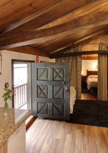 a barn door in a room with a bedroom at Casa rural en Redes para 4 in Ríoseco