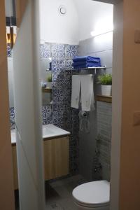 a bathroom with a toilet and a sink at Shafika house in Acre