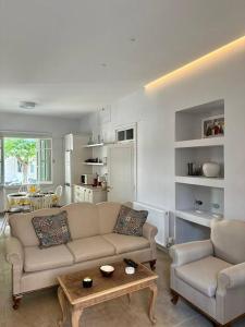 a living room with a couch and a table at Casa al Centro, Kos old town in Kos Town