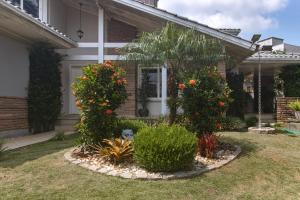 Zahrada ubytování Casa c piscina, churrasq e Wi-Fi, lazer completo