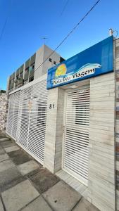 a building with two garage doors on the side of it at Pousada Praia Boa Viagem in Recife