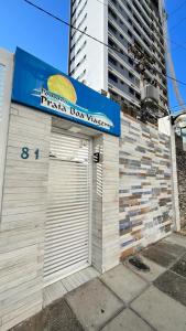 a fast food garage with a sign on top of it at Pousada Praia Boa Viagem in Recife